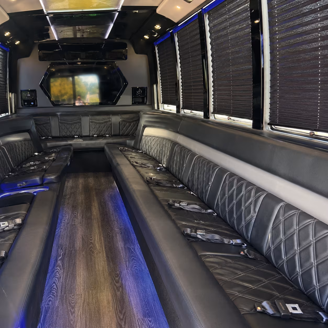 Wedding guests seated inside a party bus serving Portland
